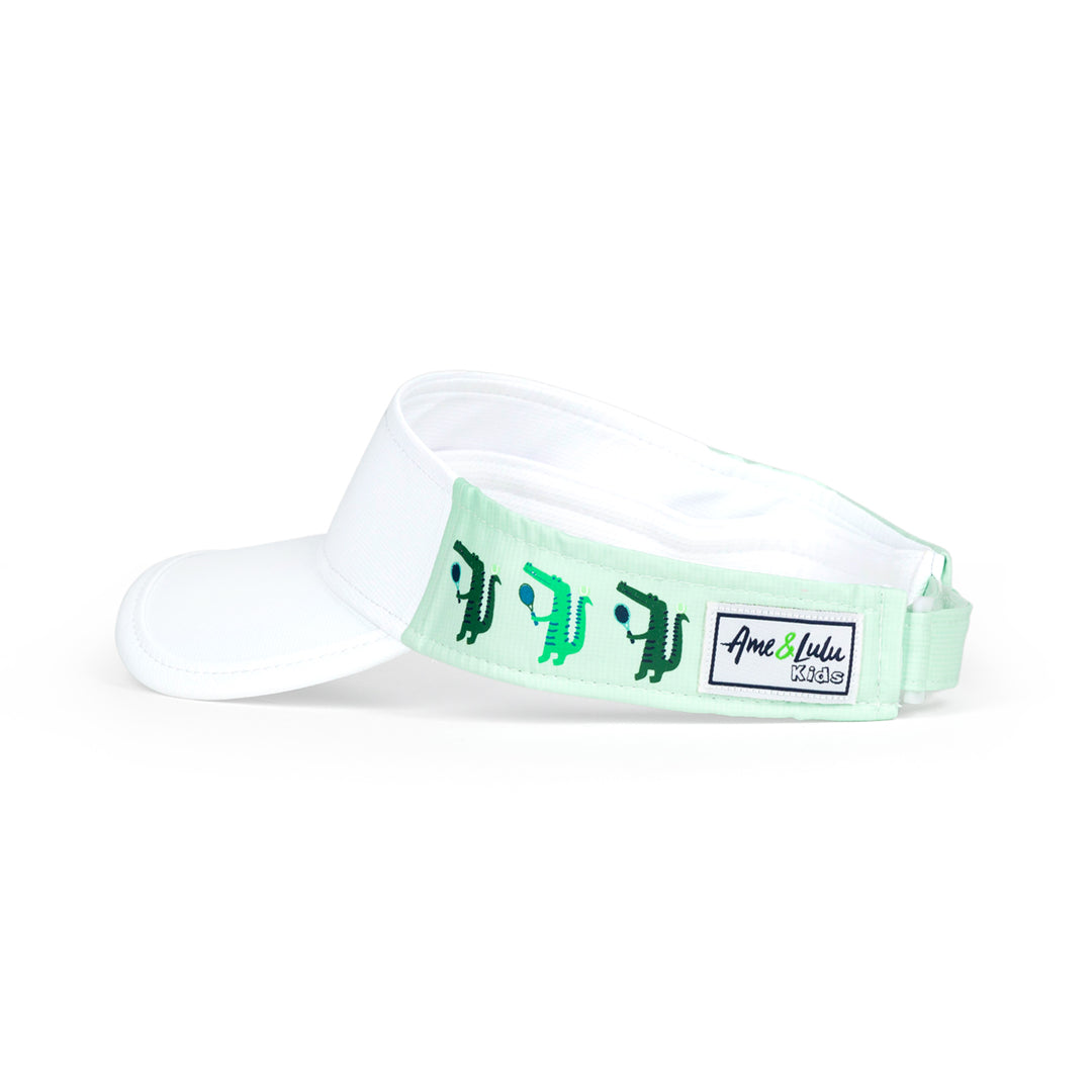 Side view of light green kids visor with alligator playing tennis on the sides.