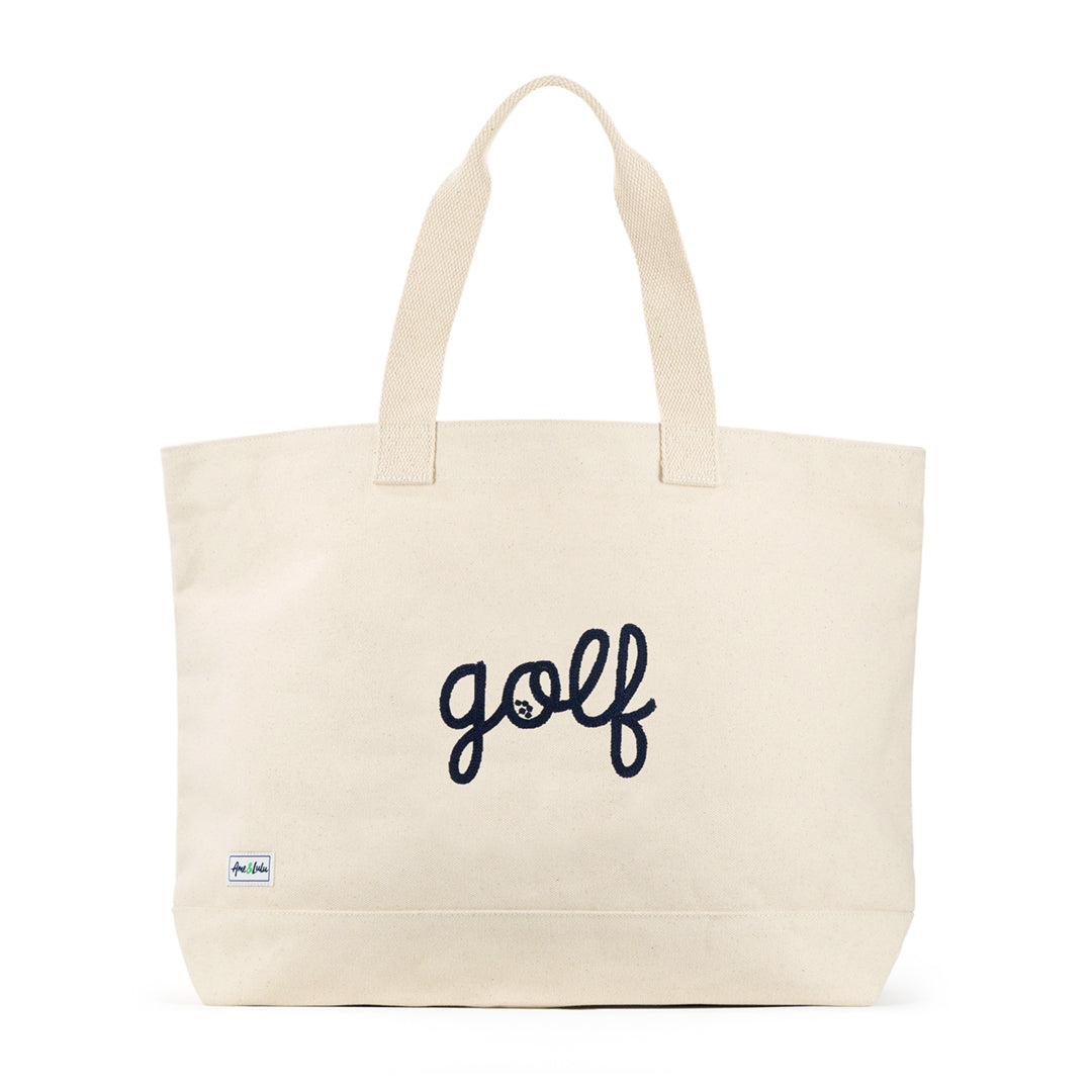 canvas tote with the world "golf" stitched in navy cursive