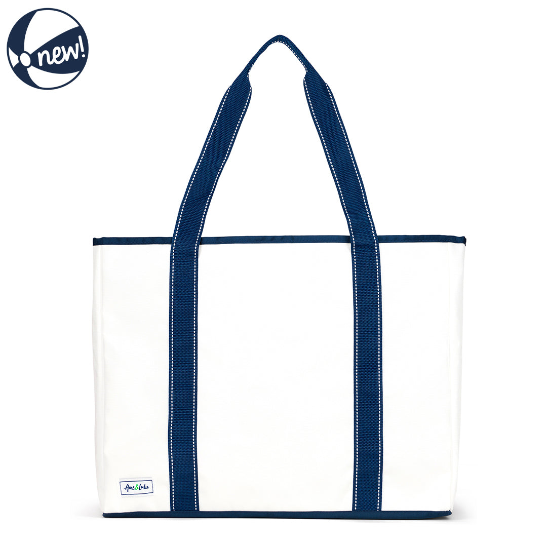 Front view of white nylon beach tote with navy straps and navy details
