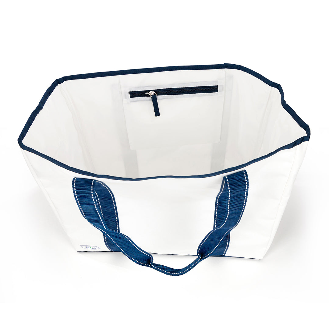 inside view of white nylon beach tote with navy straps and navy details