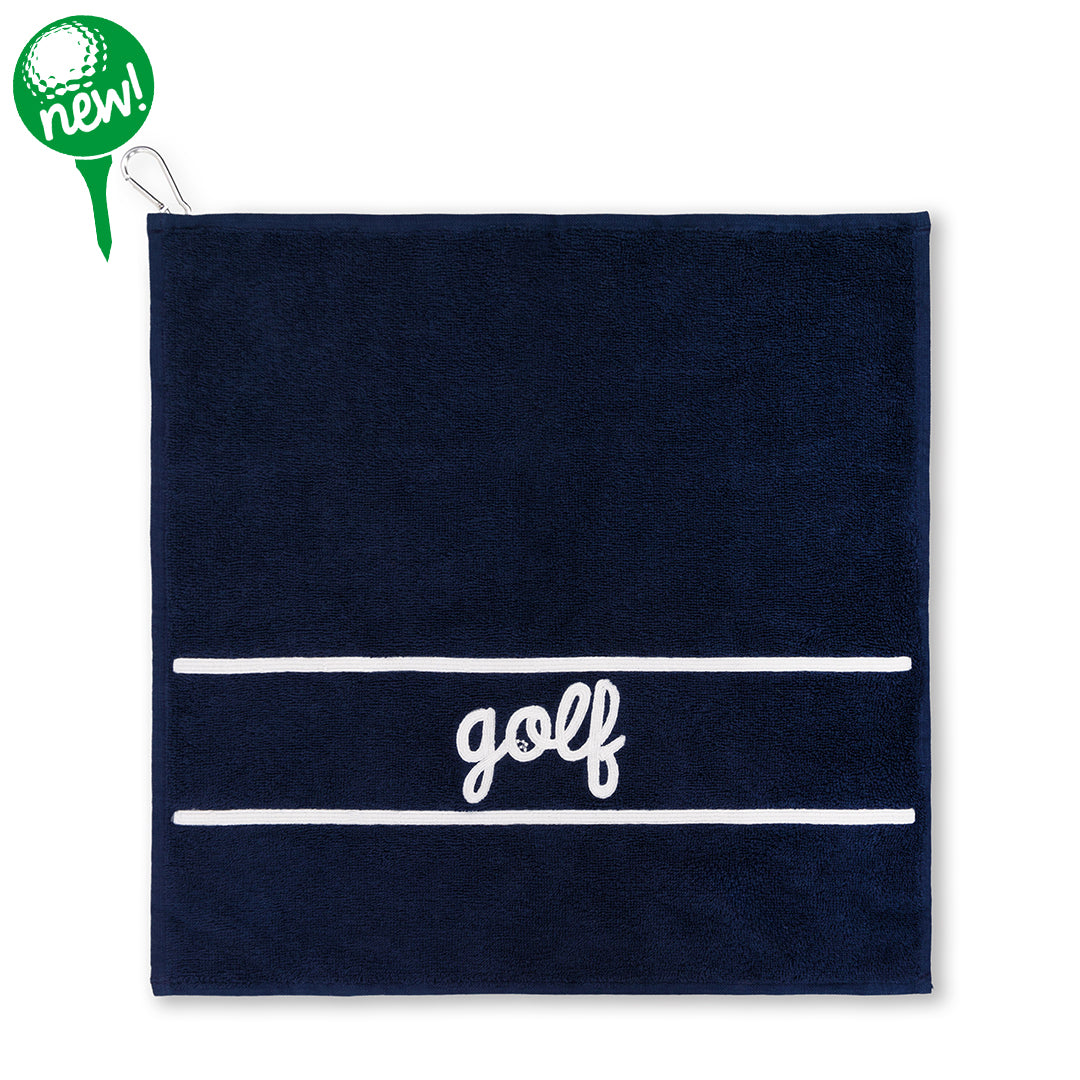 Navy cotton terry towel with the word "golf" embroidered in white cursive font on the bottom of the towel
