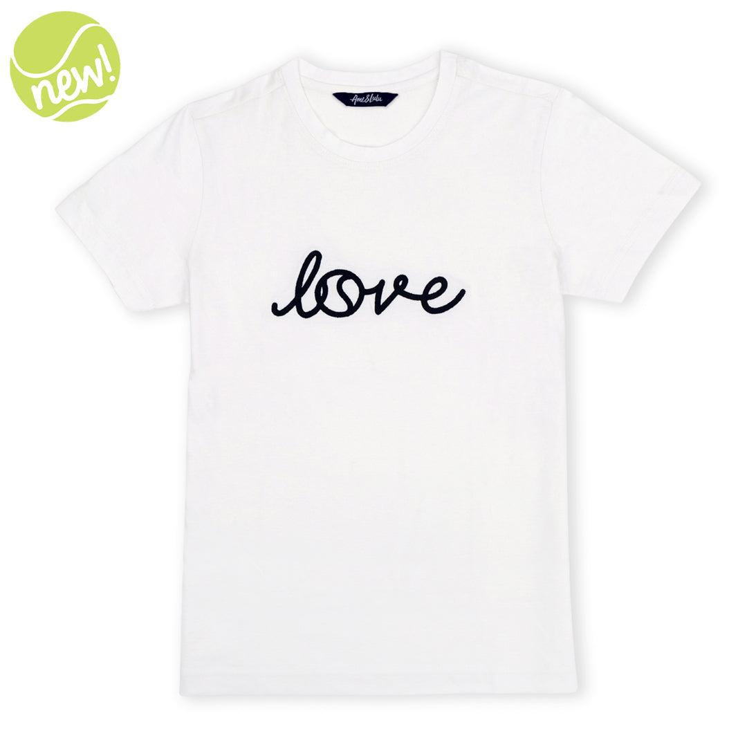 White short sleeve t-shirt lays flat on a white background with the word love embroidered on the front in a cursive font.