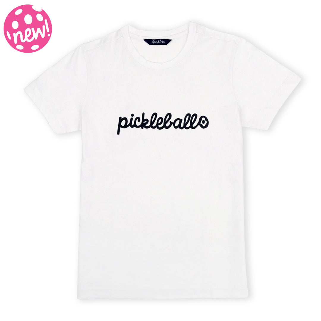 White t-shirt lays flat on a white background with the word pickleball embroidered in navy on the front in cursive