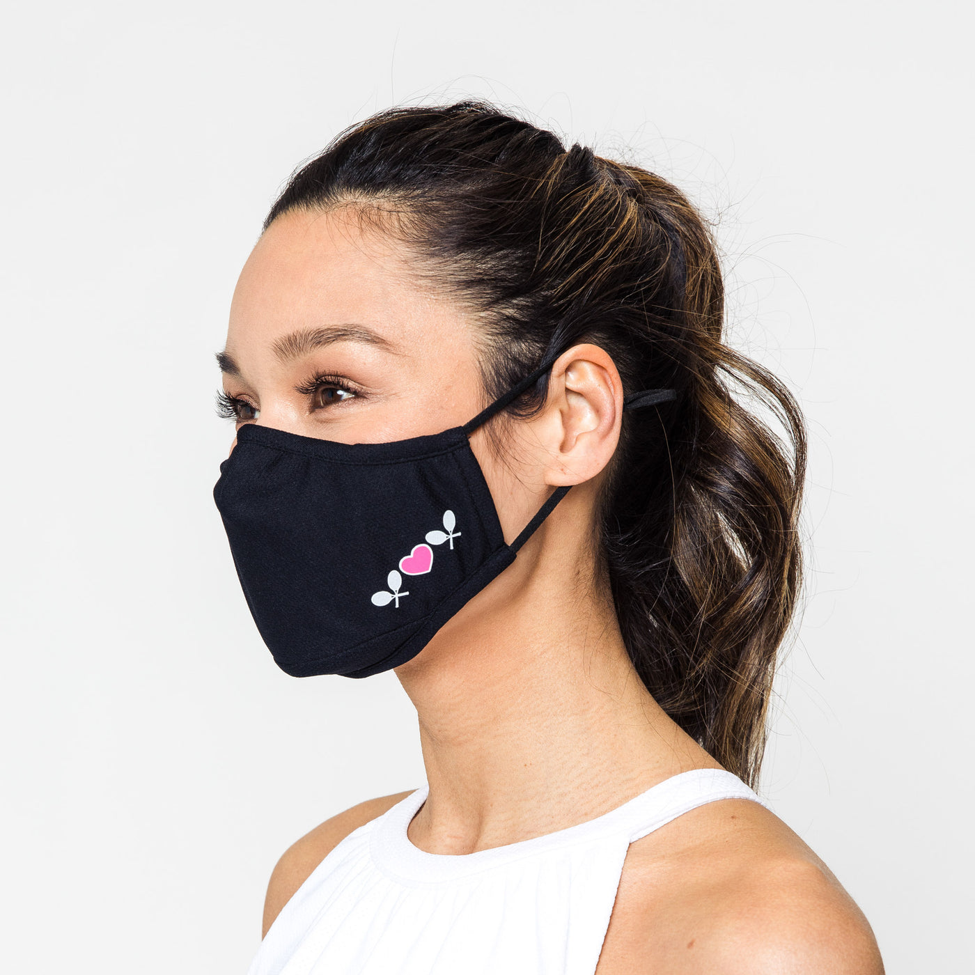 black face mask with white and pink tennis racquets and heart printed on side