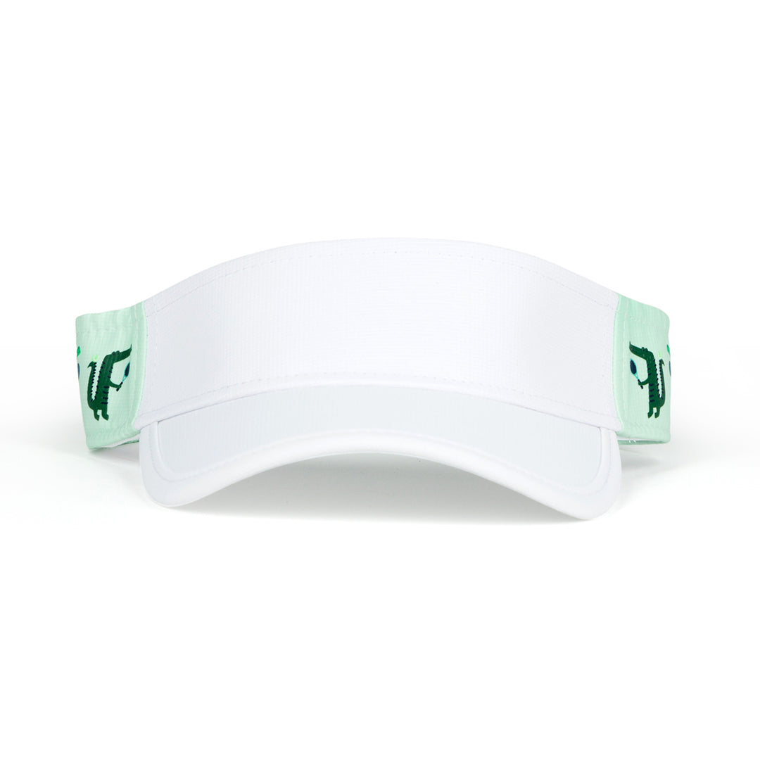 Front view of light green kids visor with alligator playing tennis on the sides.