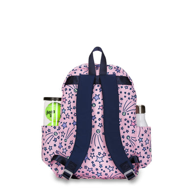 Back view of a light pink kids tennis backpack with pink and purple shooting stars and tennis balls on bag.