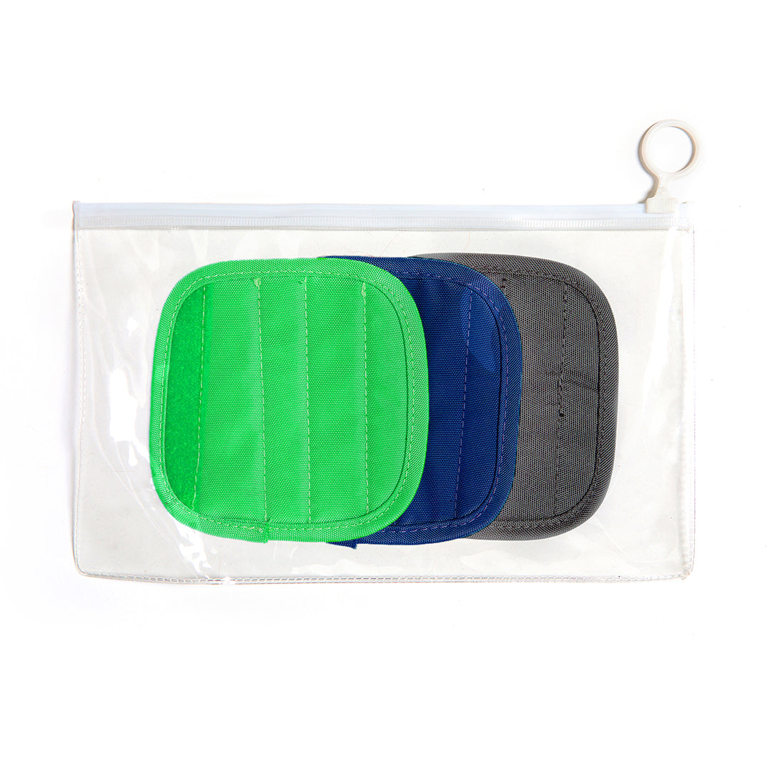 Clear case holding green, navy and grey interchangeable handle caps for tennis tote
