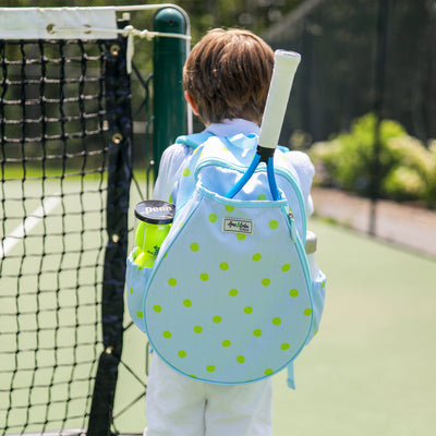 Kids tennis backpack with front pocket to hold tennis racquet. Bag is printed with a blue and white striped pattern and repeating tennis balls on the stripes.