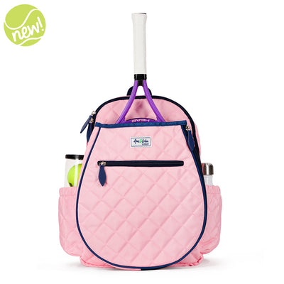 Front view of blush pink quilted kids tennis backpack with navy trim and zippers.