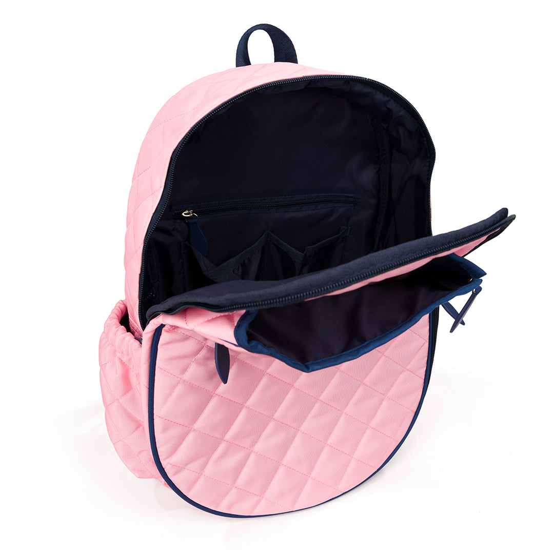 Inside view of blush pink quilted kids tennis backpack with navy trim and zippers.
