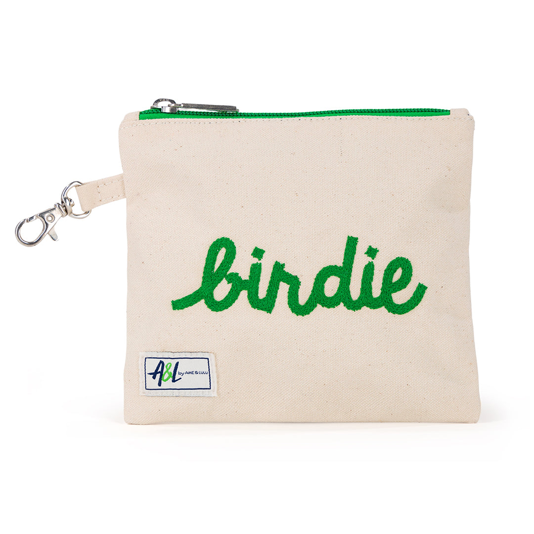 Front view of small natural canvas tee pouch with green trim and zippers. Pouch is embroidered with the word "birdie" in green