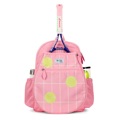Front view of coral kids tennis backpack with repeating pattern of cream grid lines and yellow tennis balls.