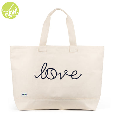 Canvas large tote with the front embroidered with the word love in a navy cursive font