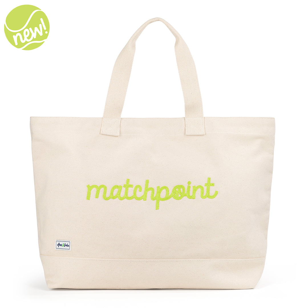 Canvas large tote with the front embroidered with the word matchpoint in a lime cursive font