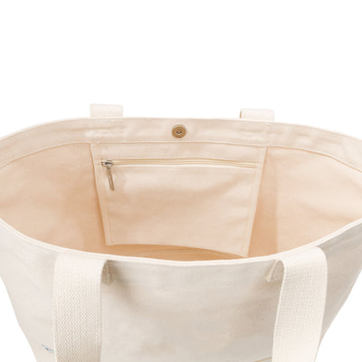 inside of canvas tote shows hanging pocket