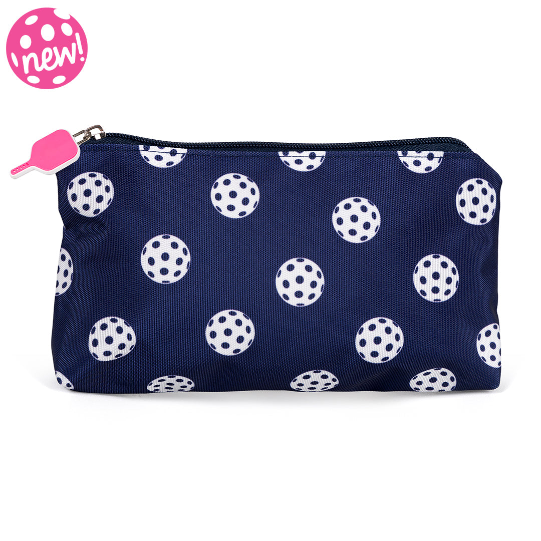 Front view of navy nylon small makeup pouch. Pouch has white pickleball printed on it and a hot pink pickleball paddle zipper.