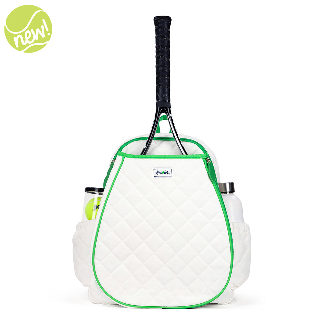 Front view of white game on tennis backpack with green trim. Backpack has quilted fabric and front pocket for tennis racquets.