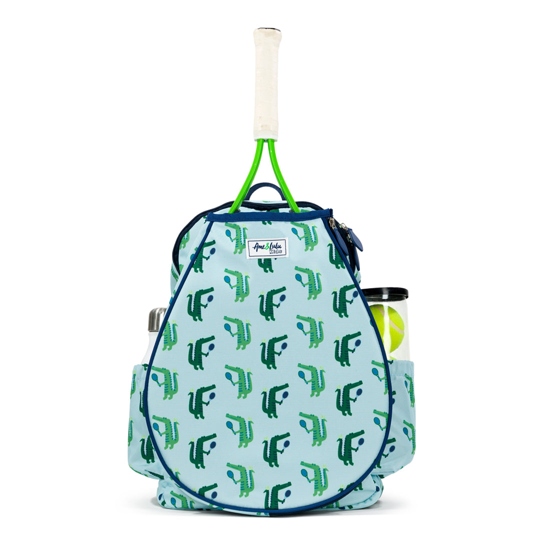 front view of blue kids tennis backpack with navy trim and repeat green alligator pattern