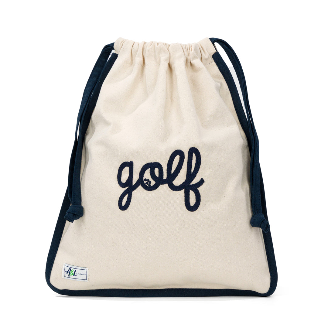 tan canvas drawstring shoe bag with the word golf embroidered on front in navy cursive