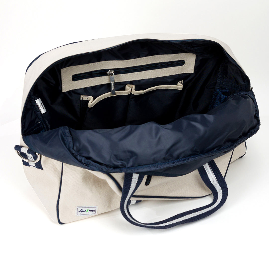 natural colored canvas pickleball bag with navy and white cotton webbing straps
