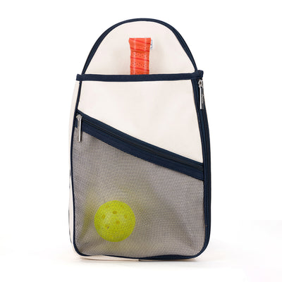 Front view of Hamptons pickleball sling bag. Bag has front mesh pocket and slip pocket on front to hold pickleball paddles. Bag has navy trim and navy and white striped straps. Bag has adjustable straps to be worn as a backpack or a crossbody.