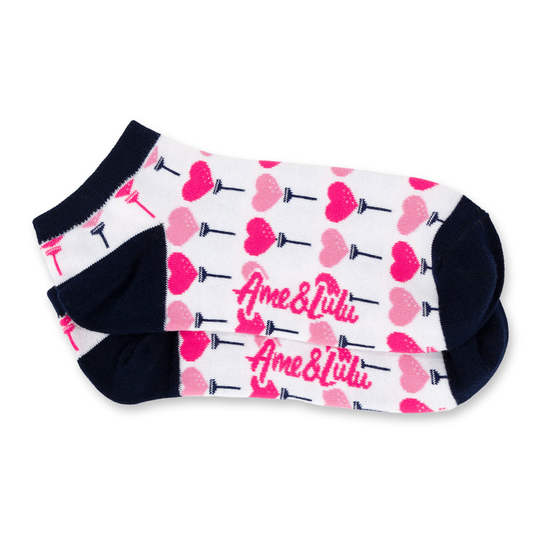 pair of white socks with pink heart shaped golf balls and tees