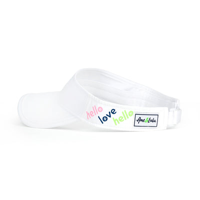 Side view of white kids visor with the words hello love in the colors pink green and navy printed on the sides.