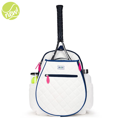 Front view of quilted white kids tennis backpack with navy trim and hot pink zippers.