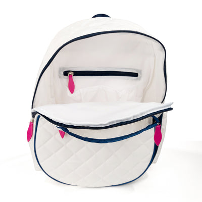 Inside view of quilted white kids tennis backpack with navy trim and hot pink zippers.