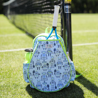 Front view of light blue kids tennis backpack with navy robots holding tennis racquets printed on the fabric. Front of backpack has a pocket for holding tennis racquets.