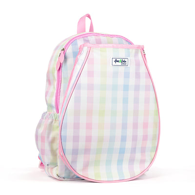 side view of rainbow gingham patterned kids tennis backpack with pink trim and zippers. Front pocket holds tennis racquets