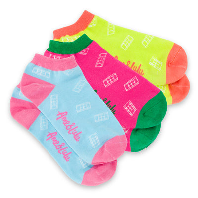 three pack of lawn tennis socks. Blue sock with pink trim, hot pink sock with green trim and yellow sock with red trim. All socks have white tennis court repeating pattern on them