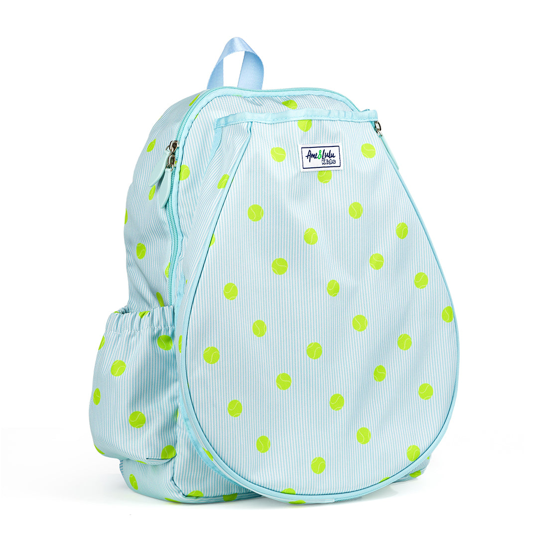 Kids tennis backpack with front pocket to hold tennis racquet. Bag is printed with a blue and white striped pattern and repeating tennis balls on the stripes.