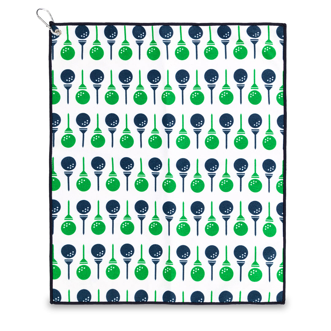 small white towel with navy and green golf balls and tee pattern