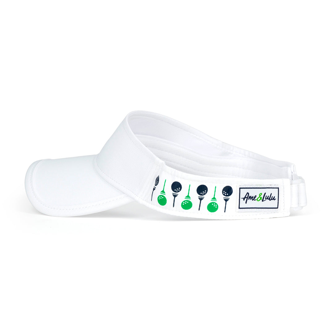 side view of white womens visor with navy and green golf balls and tee printed on sides.