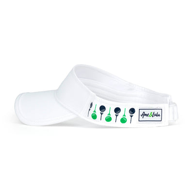 side view of white womens visor with navy and green golf balls and tee printed on sides.