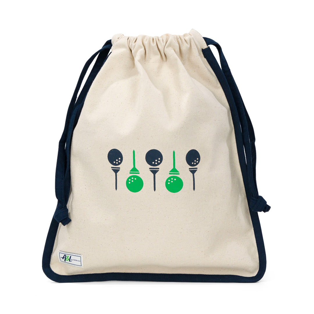 tan canvas drawstring shoe bag with navy and green golf balls and tees on front