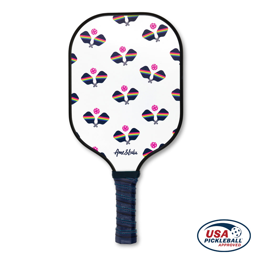 White base color pickleball paddle with navy and rainbow stiped paddles printed on front. Paddle has navy and blue handle