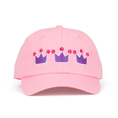 Front view of light pink kids baseball hat with purple crowns and tennis balls embroidered on front.