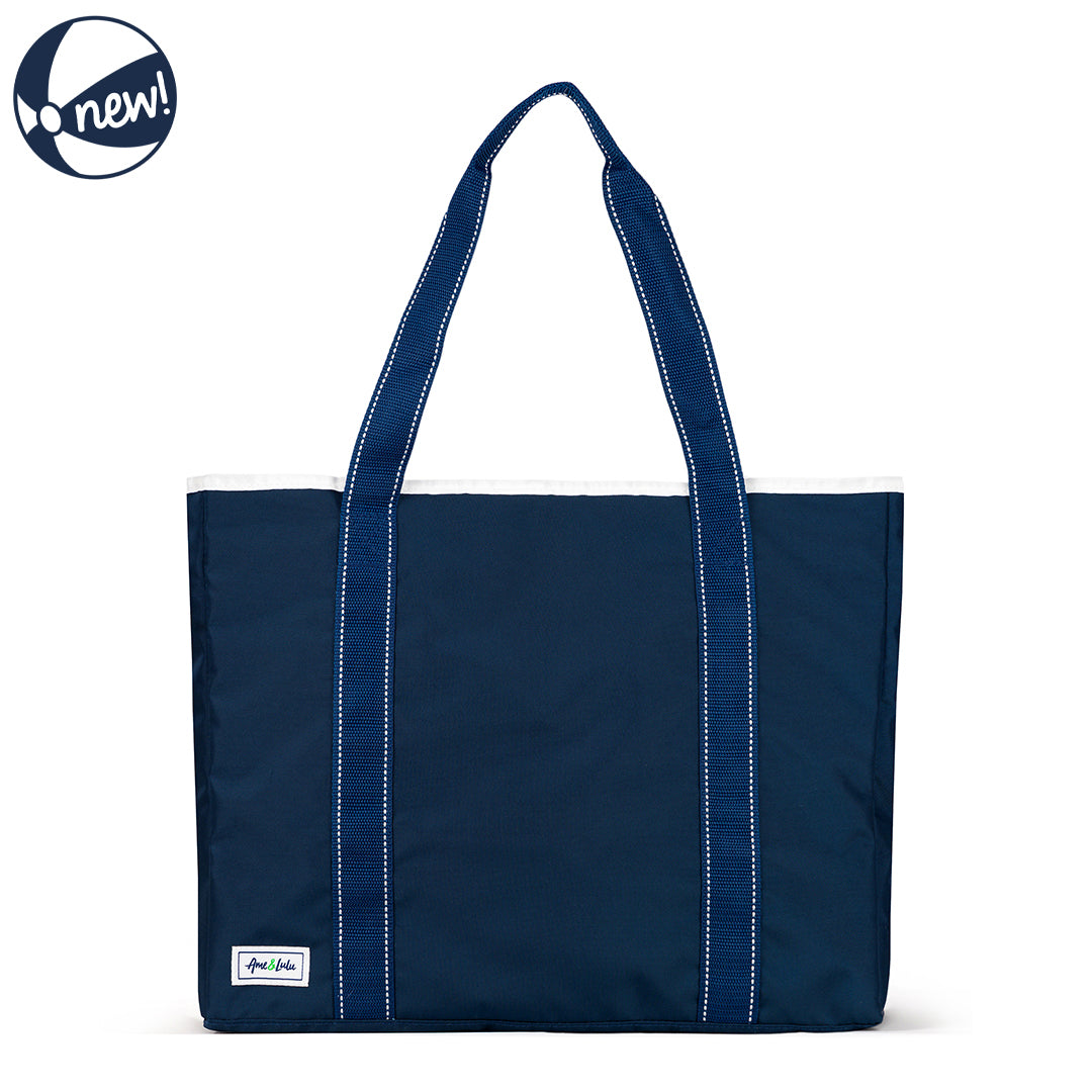 Front view of navy beach tote with navy straps and white details.
