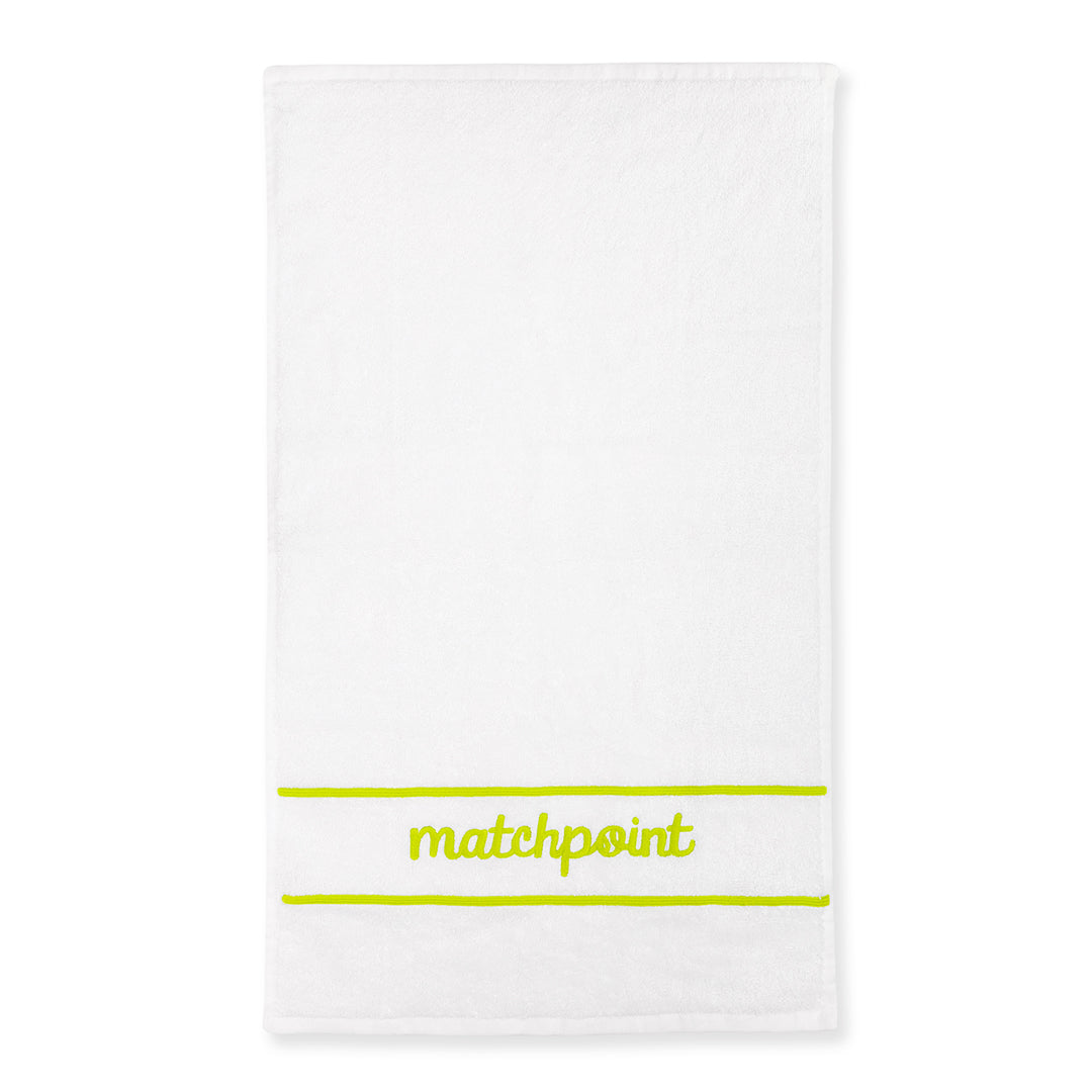 White cotton terry towel with the word "matchpoint" embroidered on in lime with embroidered line above and below the word.