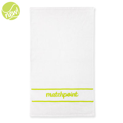 White cotton terry towel with the word "matchpoint" embroidered on in lime with embroidered line above and below the word.