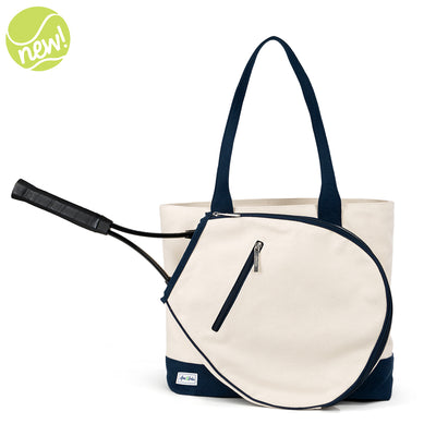 Front view of canvas tennis tote with navy straps and a front pocket for holding a tennis racquet