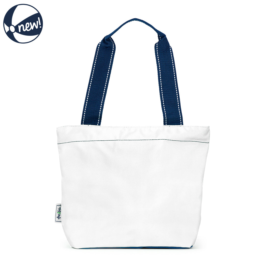 Front view of white mini surfside tote. Tote have navy details and navy straps