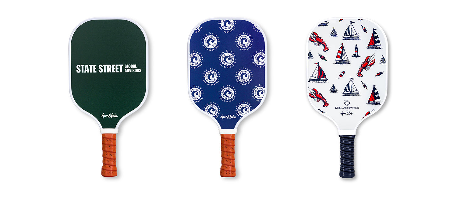 Three pickleball paddles with different designs against a white background, showcasing active lifestyle accessories.