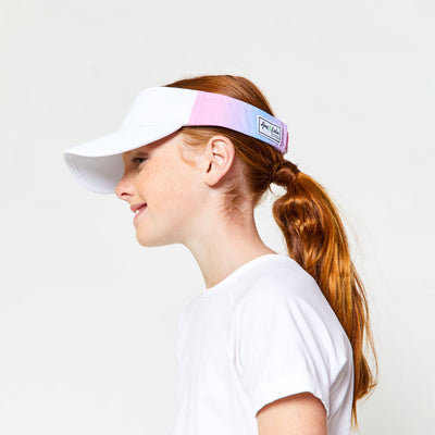 Little girl wearing pink and blue ombre kids visor