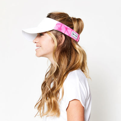 Little girl wearing hot pink tie dye pattern kids visor