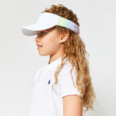 Little girl wearing rainbow ombre kids visor.