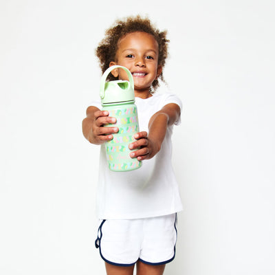 Little girl holding Light green kids water bottle with pastel rainbow tennis ball pattern