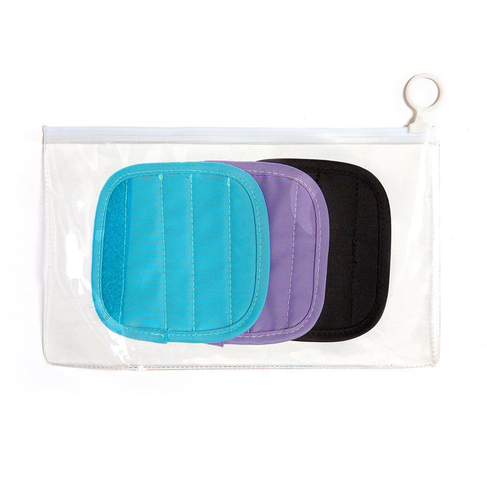 Clear pouch holds three interchangeable handle caps in blue, purple and black.